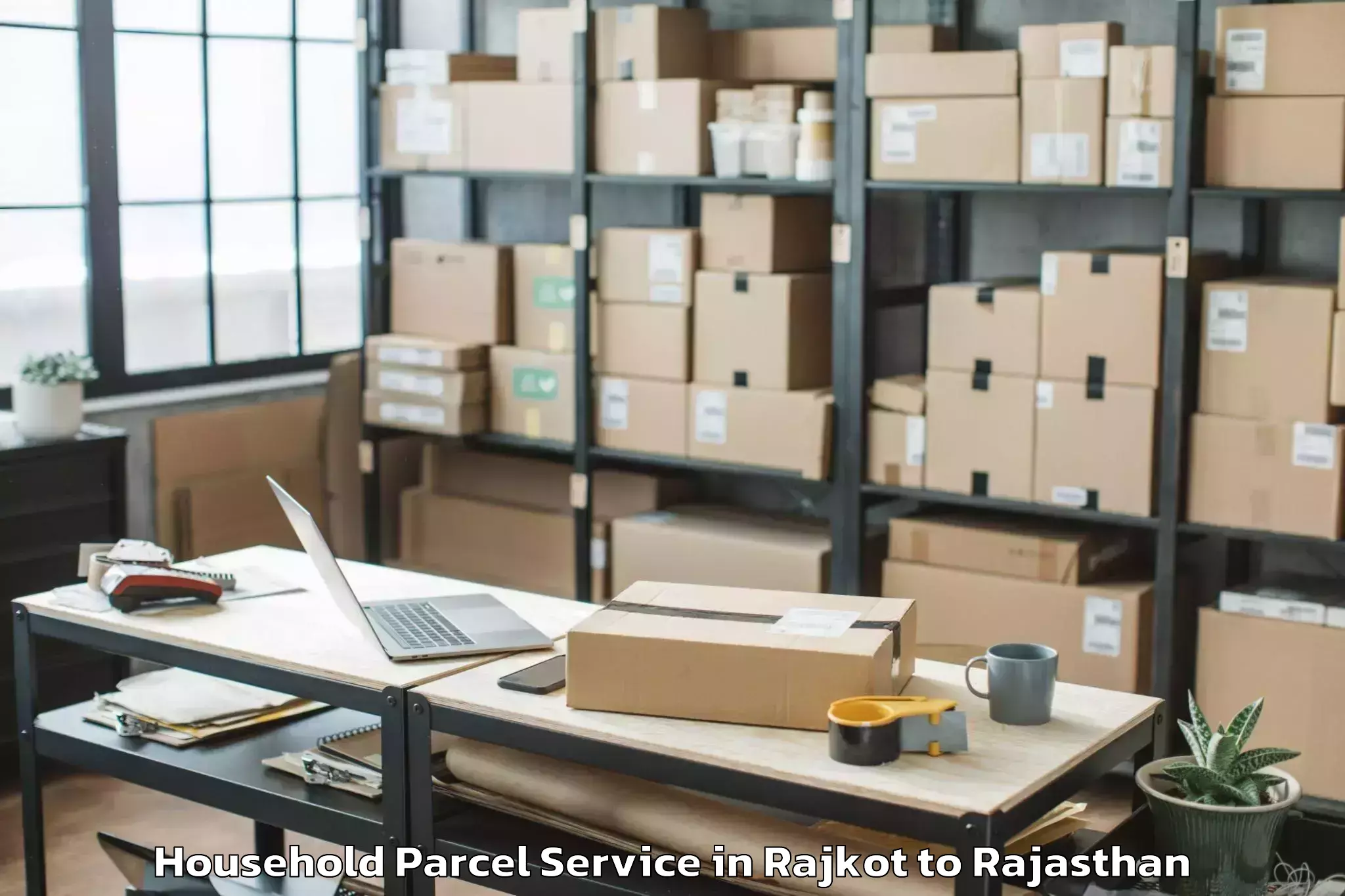 Reliable Rajkot to Opjs University Churu Household Parcel